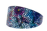 Dark midnight blue leather collar with a floral mosaic pattern of irregular white spots and vibrant purple, pink, and blue flowers, shown on a white background.