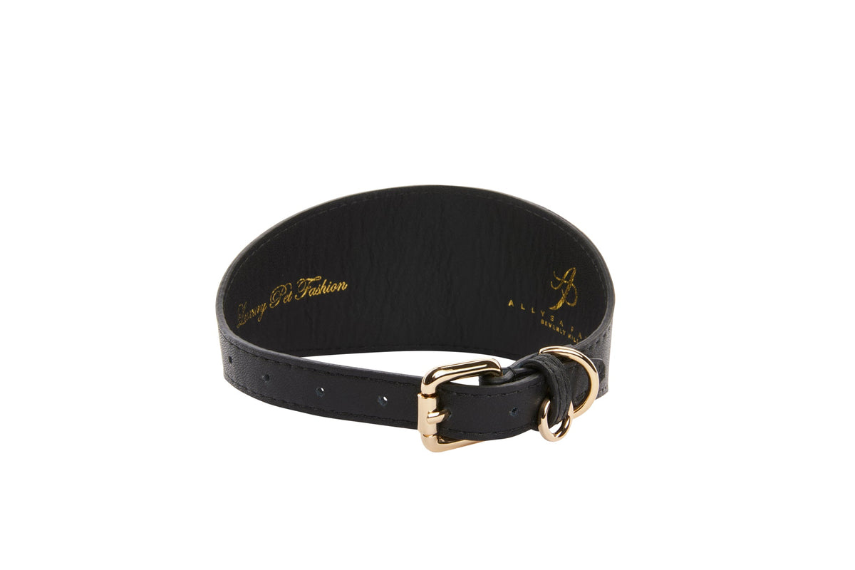 Black 2-inch wide vegan leather collar with gold buckle and D-ring, featuring embossed gold text on inner band