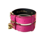 Soft fuchsia Italian leather pet collar with gold hardware and two attached gold heart-shaped charms shown on a white background.