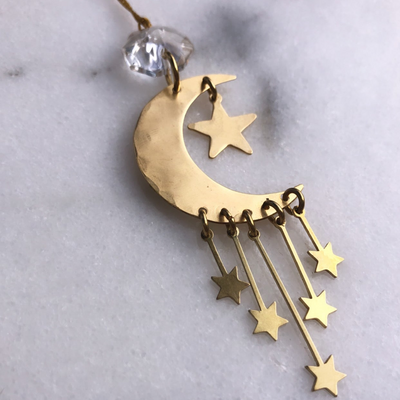Guiding Star Ornament with hammered brass star and vintage glass crystal hanging on wall