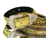 Soft yellow and black snakeskin pattern pet collar and leash with Swarovski crystal hardware laid out on a neutral surface
