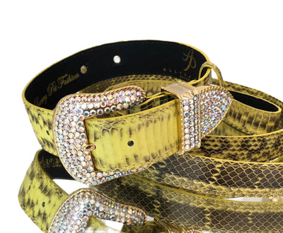 Soft yellow and black snakeskin pattern pet collar and leash with Swarovski crystal hardware laid out on a neutral surface
