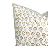White pillow cover printed with a repeating pattern of small marigold-yellow flowers and gray leaves arranged in rows.
