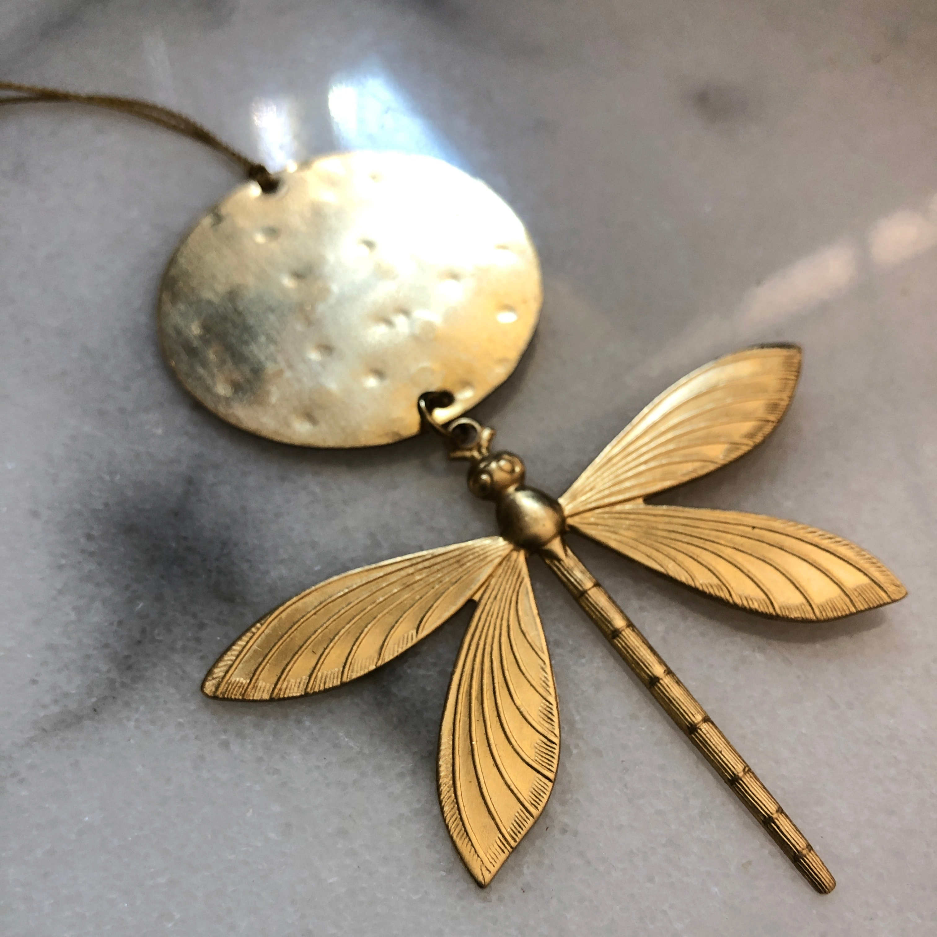 Winds of Change Dragonfly Ornament in hammered brass with hanging twine