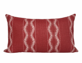 Rectangular red pillow cover with vertical white wavy and linear embroidery patterns evenly spaced across its surface.