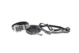 Black and white patterned dog collar and matching leash set with silver buckle adorned with clear rhinestones, displayed on a white background.