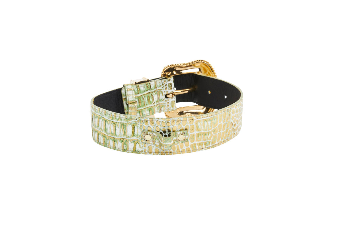 Green and gold embossed crocodile pattern leather collar with gold-tone metal buckle and Swarovski crystal embellishment near the buckle end.