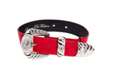 Red distressed leather belt with large silver ornate buckle, loop, and tip featuring intricate swirling patterns and embedded Swarovski crystals.