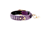 Extra small purple snake-patterned collar with gold vintage hardware and a small pearl charm hanging from a gold ring.