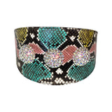 Wide collar with multicolor embossed snake pattern in turquoise, yellow, pink, and black, adorned with three large sparkling Swarovski crystal rivets