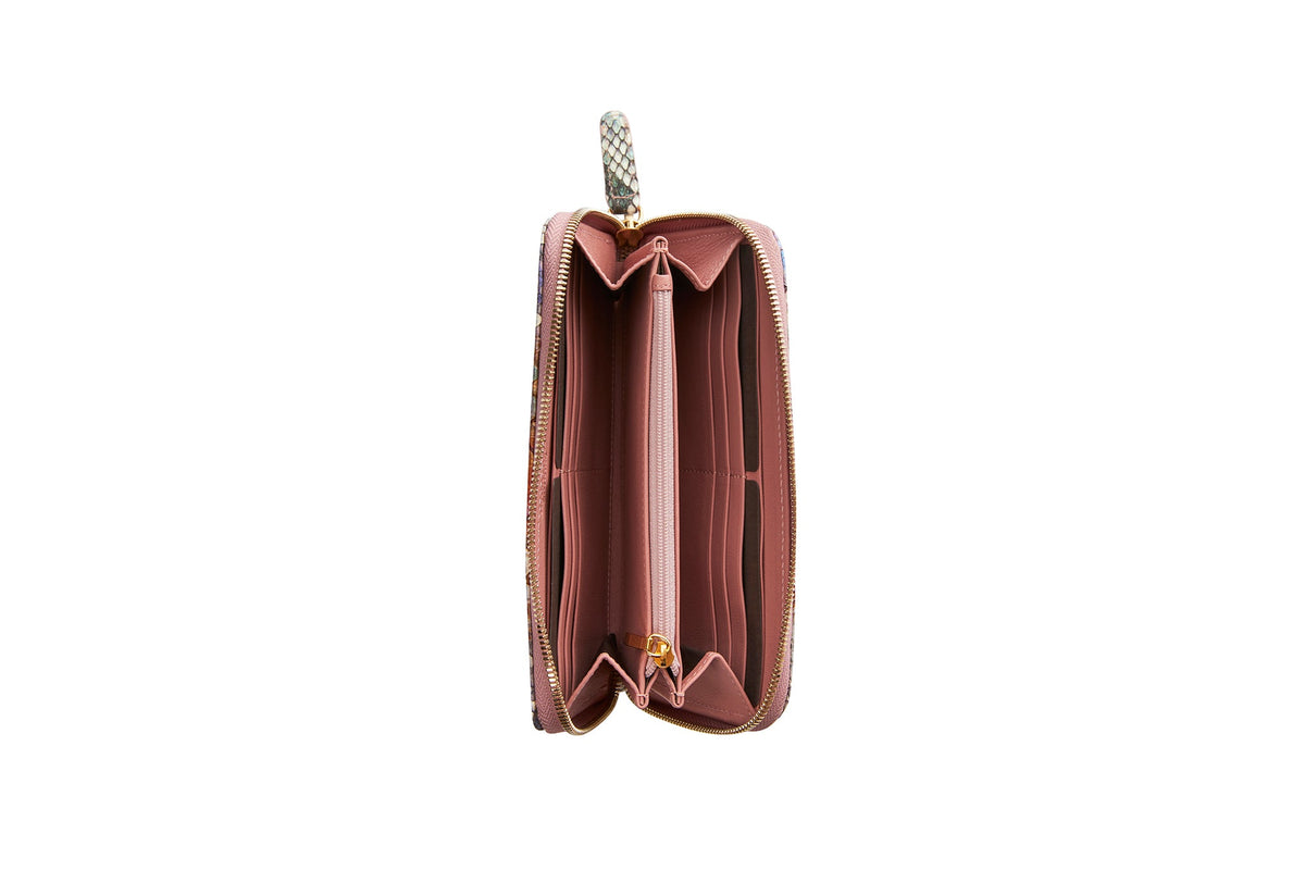 Open pink zip wallet with multiple card slots and compartments, featuring a python-patterned zipper pull tab in light colors.
