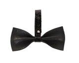 Black bowtie made of textured leather with a wide center strap featuring a silver Swarovski crystal closure.
