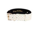 White Italian leather pet collar with gold polka dots and gold buckle, displaying 'Luxury Pet Fashion' embossed inside in gold lettering.