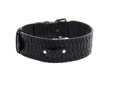 Black embossed snake-patterned leather bracelet with a gold buckle and oval gold studs, shown partially open on a white background.
