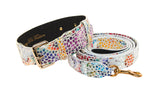 White Italian leather dog collar and matching leash with colorful floral mosaic pattern and gold metal buckle and clasp details.
