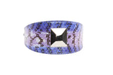 Curved iridescent snake skin collar in purple and black hues featuring a central large silver pyramid-shaped stud.