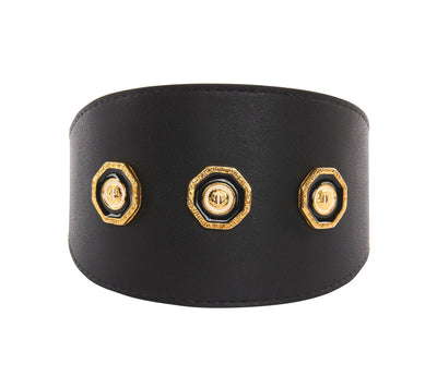Luxury black Italian leather pet collar with white, gold, and black vintage rivets laid flat