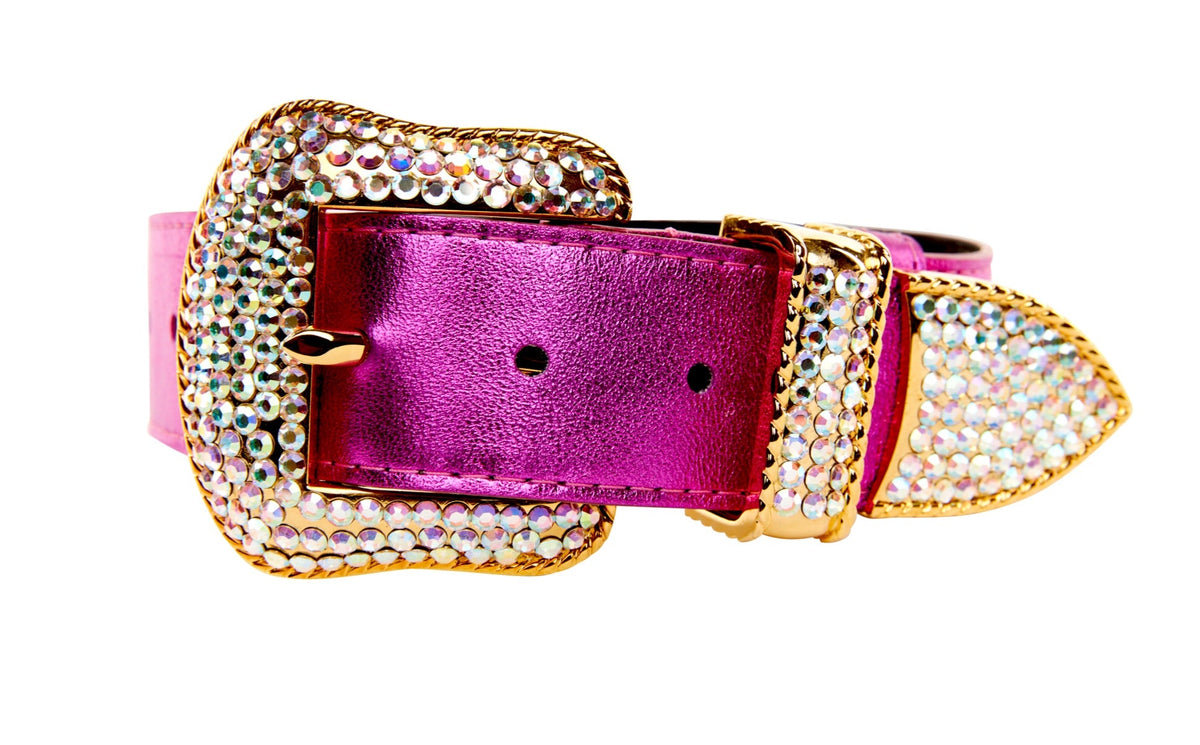 Bright pink foil Italian leather collar with large gold buckle and strap tip encrusted with clear Swarovski crystals against a white background.