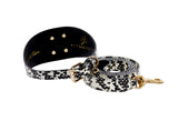Black and white snake pattern dog collar and leash set with gold metal buckle, rivets, and clasp, featuring a 3-inch width collar detail and rolled leash.