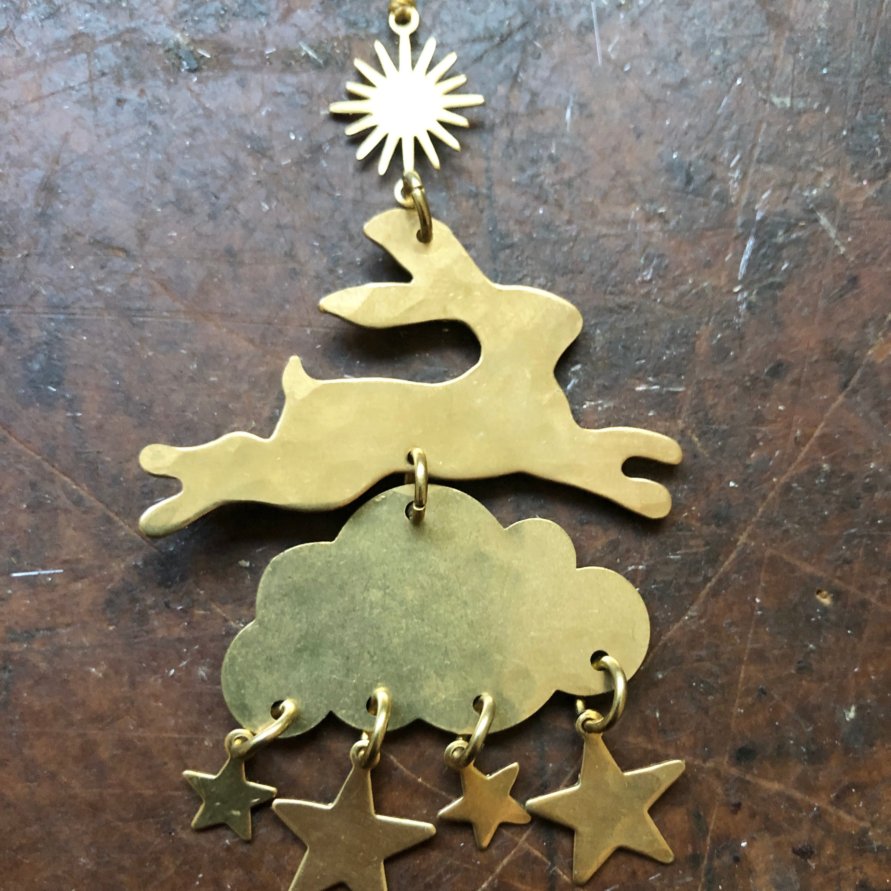 Wonderland Ornament by Vida + Luz, hand-cut hammered brass wall hanging with hanging cord