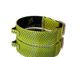 Neon green pet collar with snakeskin texture and gold classic buckle hardware, shown coiled against a white background.