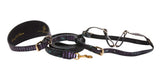 Black, green, and purple snake-patterned wide collar, matching leash, and adjustable harness laid out on white background with gold-tone hardware accents.