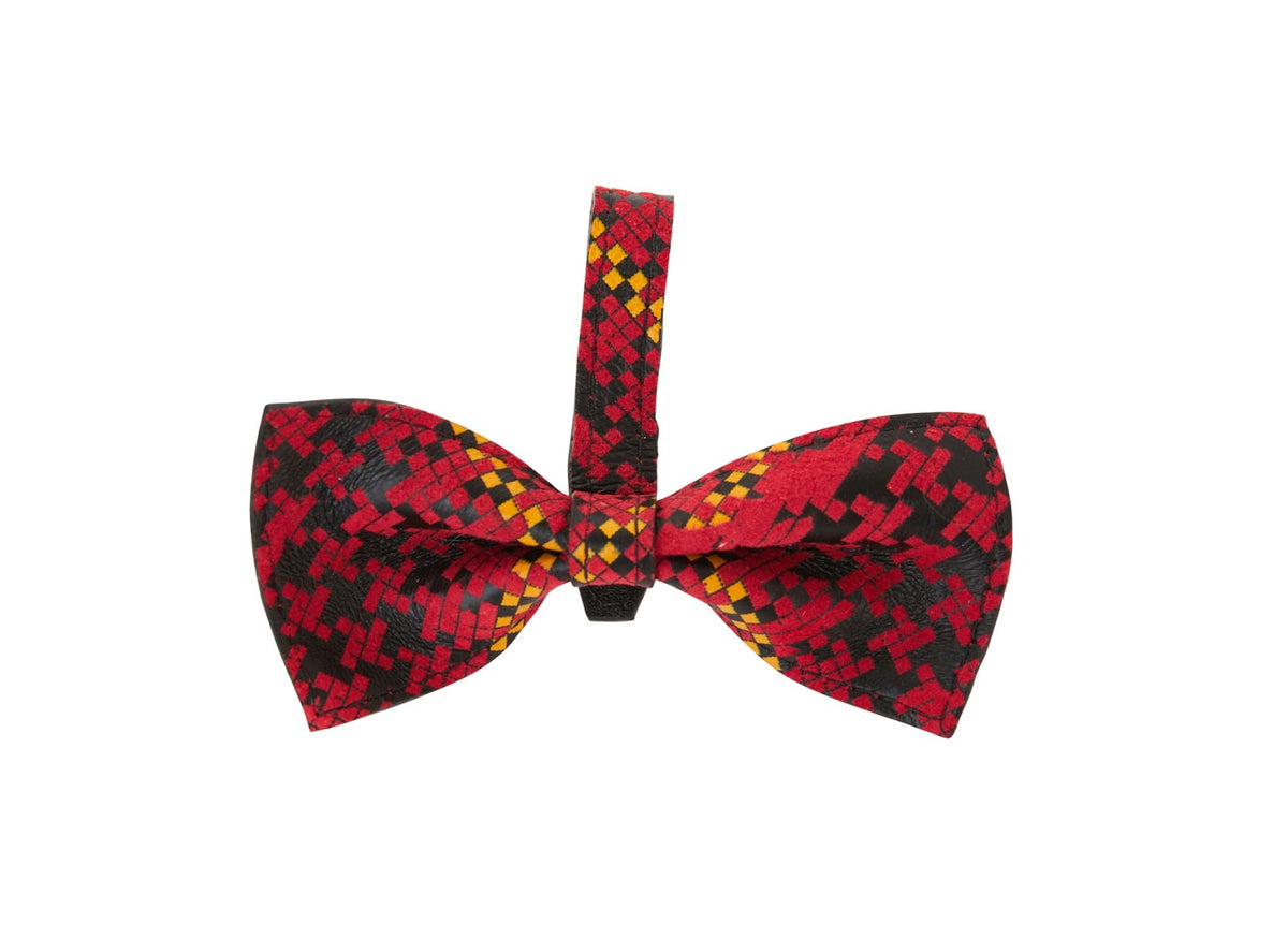 Red bowtie with a yellow and black plaid pattern, displayed against a white background, with an adjustable strap looped above the bow.
