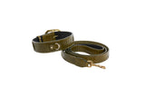 Olive green snake-patterned collar and matching leash with gold-tone buckle and clasp, displayed coiled on a white background.