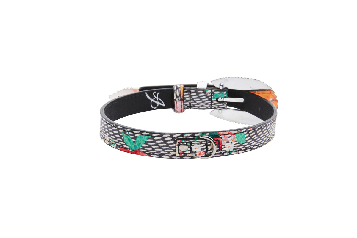 Leather collar embossed with black and gray snake print, featuring painted pansy flowers in orange and green with a silver D-ring buckle, shown flat on white background.