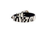 Black and white zebra print leather bracelet with hair-on-hide texture and polished silver-tone buckle and hardware details.