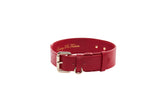 Red vegan leather classic collar with gold hardware displayed on a white background