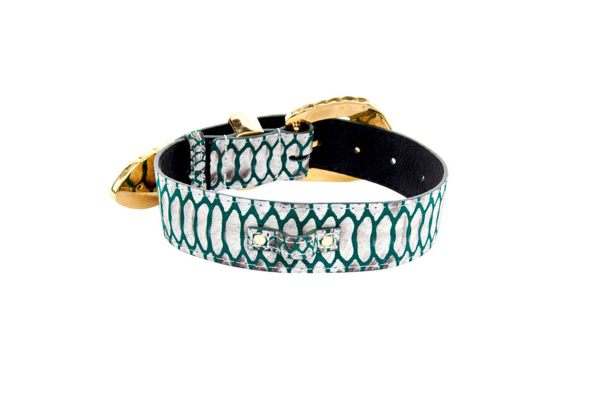 Green and off-white embossed python print leather belt with gold-tone ornate metal buckle and tip, shown coiled on white background.