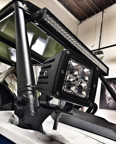 Black powder coated Polaris RZR pillar mounts installed on vehicle cage pillars