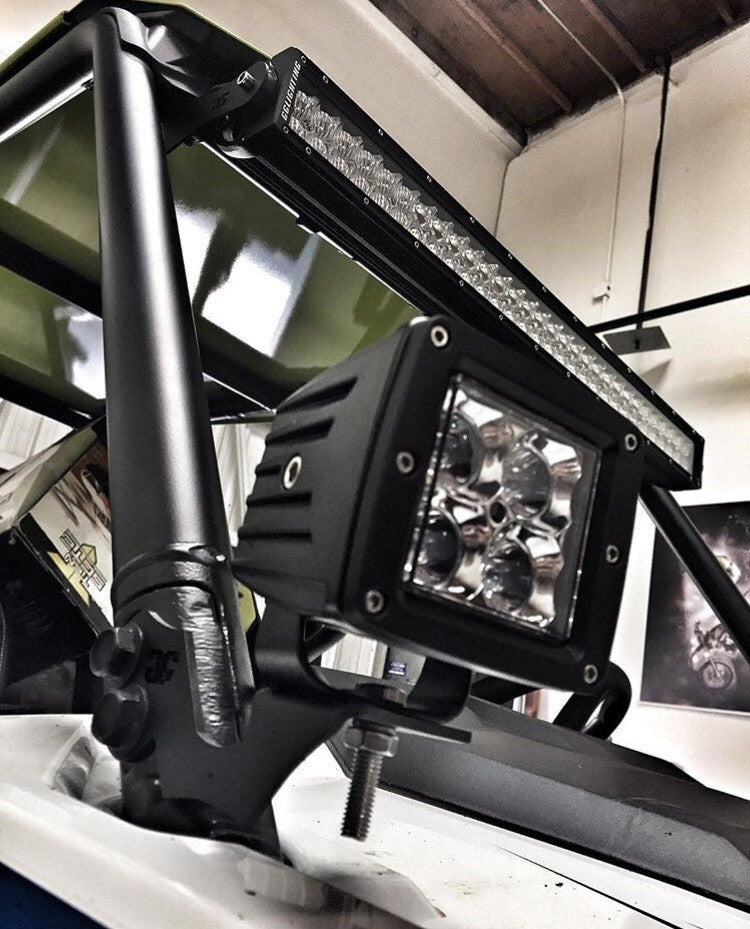 Black powder coated Polaris RZR pillar mounts installed on vehicle cage pillars