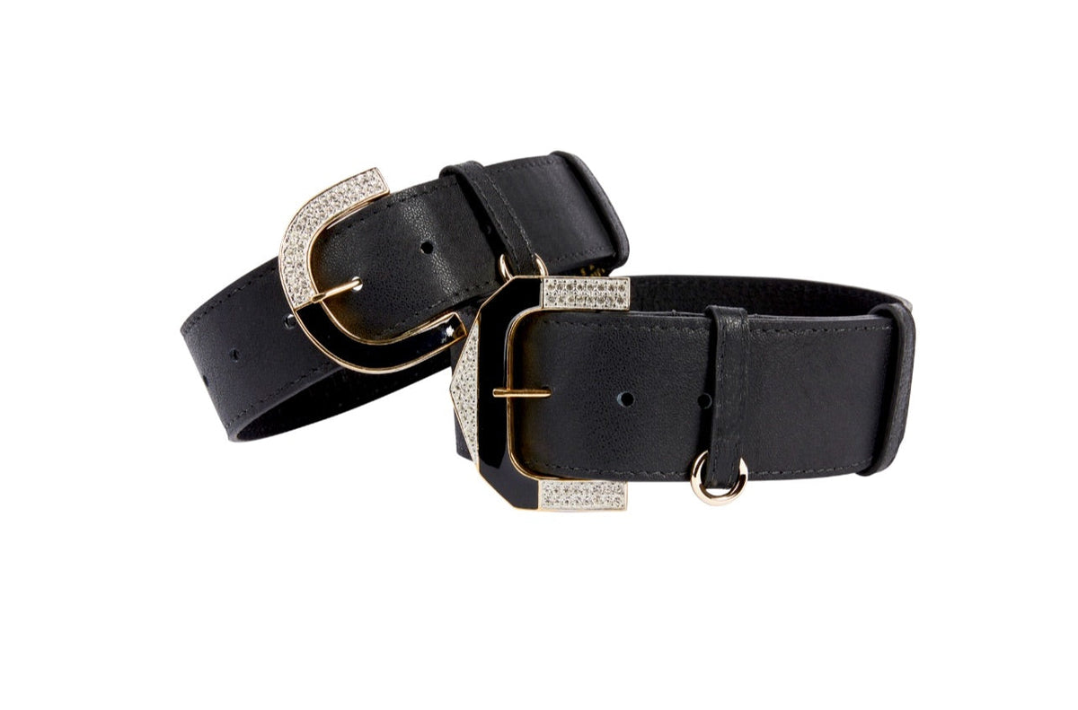 Two black Italian leather collars with gold-tone buckles featuring embedded clear crystals, shown on a white background.