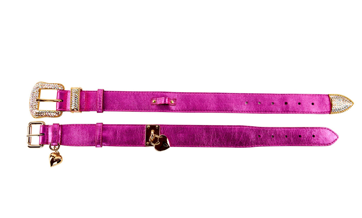 Two vibrant pink leather collars with foil finish, one featuring a rhinestone-encrusted buckle and the other with a small gold heart charm.