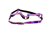 Two-tone purple snake-patterned leather harness with gold-tone buckles and adjustable straps, displayed against a white background.