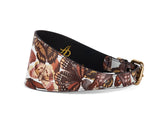 3-inch-wide style dog collar with brown and cream butterfly print on Italian leather, featuring a gold-toned metal buckle and black inner lining.