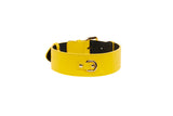 Yellow Italian leather dog collar with gold classic metal buckle and black interior lining, shown in a slightly curved profile on a white background.