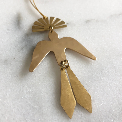 Sun Chaser Ornament by Vida + Luz, brass celestial wall hanging with hanging cord