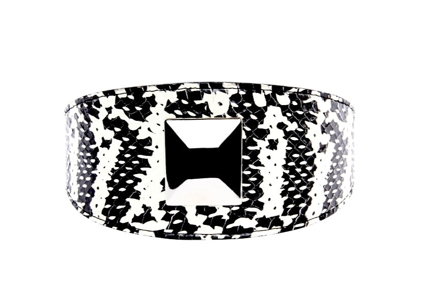 Wide black and white snake-patterned collar with a large square silver rivet centered on its front, shown against a white background.