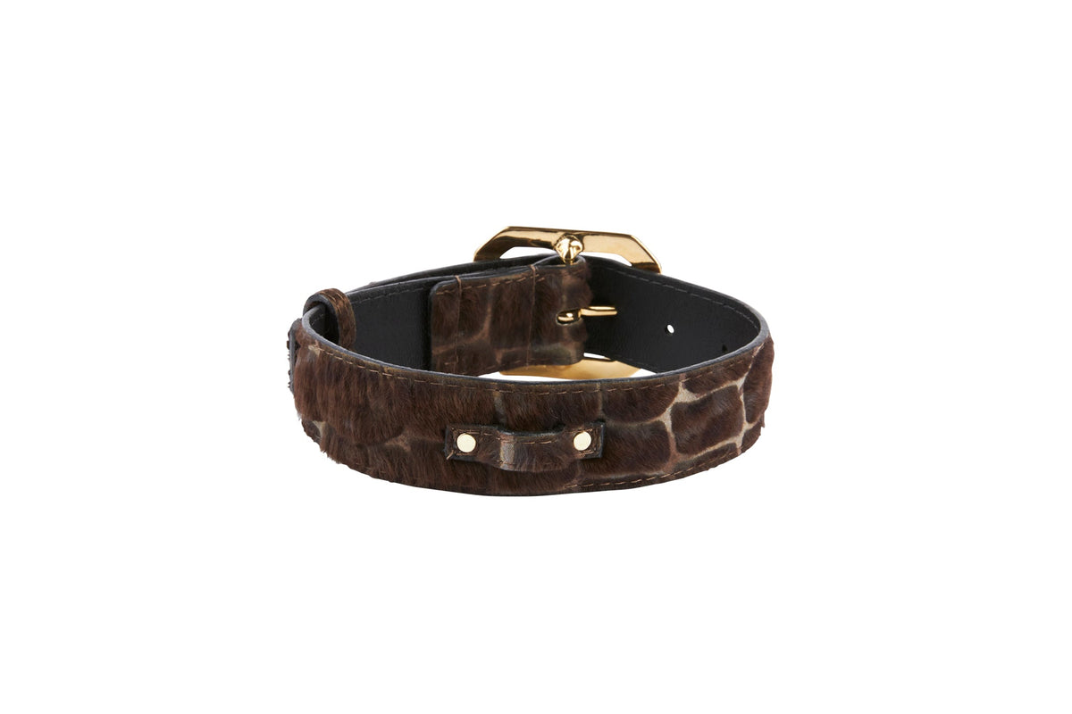 Brown hair-on-hide leather strap with snake print texture and gold buckle, shown in a coiled position on a white background.