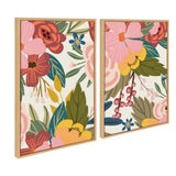 Two framed canvas art pieces featuring colorful floral patterns with pink, red, yellow flowers and green leaves on a cream background, arranged side by side.