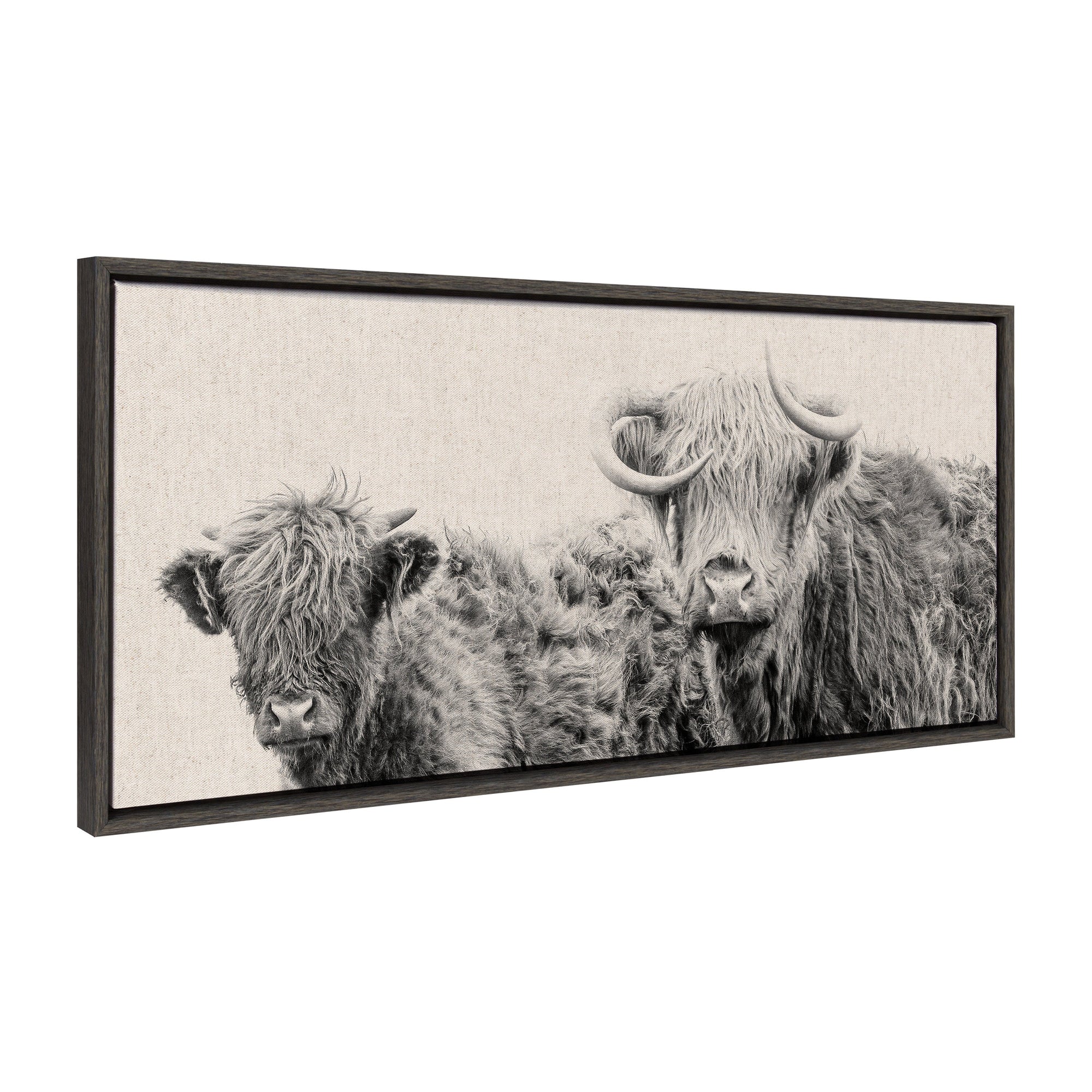 Framed canvas art showing two Highland cows with a neutral linen bright background