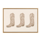 Three identical light brown cowboy boots with decorative stitching, evenly spaced and displayed side by side on a cream background within a light wood frame.