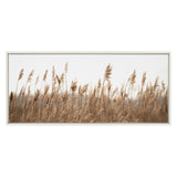 Framed canvas showing tall, delicate marsh grass in soft brown tones against a pale, unobtrusive background, creating a serene nature scene.