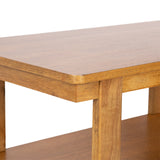 Close-up of a Foxford rectangle coffee table corner made of warm-toned wood with a smooth surface and slightly rounded edges on the tabletop and leg.