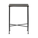 Minimalist black metal side table with a rectangular tray top and four slender legs connected by cross braces at the base, shown against a white background.