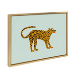 Framed canvas painting of a stylized leopard with orange and black spots on a light blue background by Kendra Dandy.