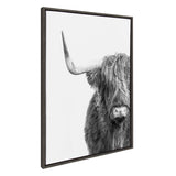 Close-up grayscale portrait of a Highland cow facing forward with one long horn and shaggy hair covering its eyes, set against a plain white background.